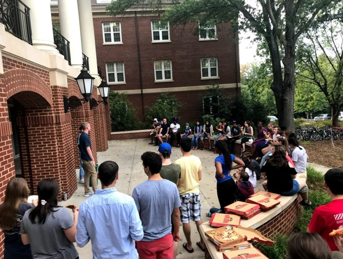 Office of Sustainability discusses composting on patio of Rutherford