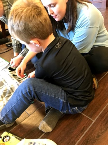 Cooper & FRC Director’s Assistant Grace making a blanket