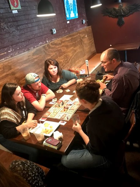 FRC members at Rook & Pawn playing board games