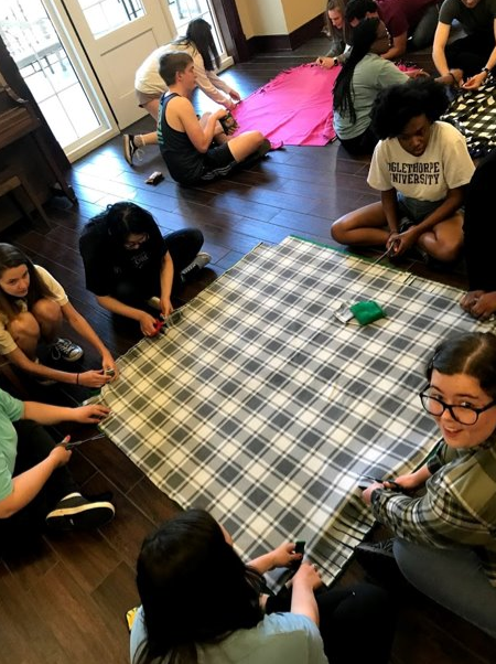 FRC members making blankets for the homeless