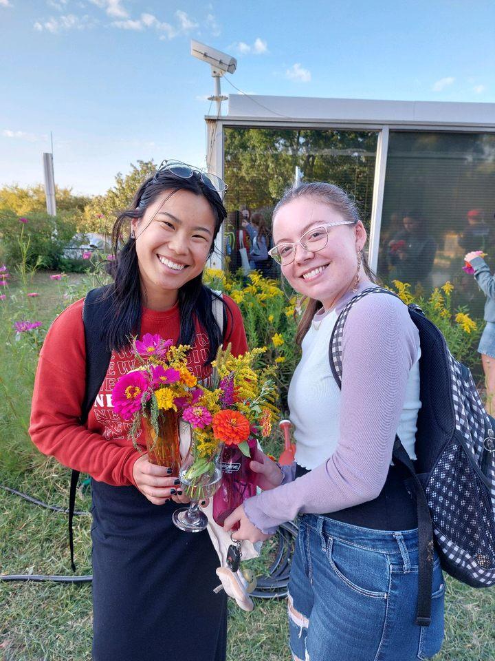 FRC member and PR Chair Sophie Forbes with Zinnia plants