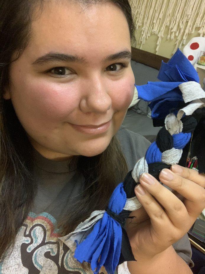 Faith displays her handiwork